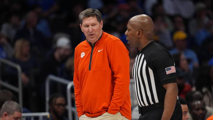 Mar 13, 2026; Charlotte, NC, USA; Clemson Tigers head coach Brad Brownell talks with the official during the first half against the Clemson Tigers at Spectrum Center. Mandatory Credit: Jim Dedmon-Imagn Images