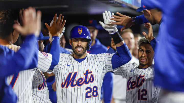 May 30, 2024; New York City, New York, USA; New York Mets designated hitter J.D. Martinez (28) celebrates with teammates in the dugout after hitting a solo home run in the eighth inning against the Arizona Diamondbacks at Citi Field. Mandatory Credit: Wendell Cruz-USA TODAY Sports