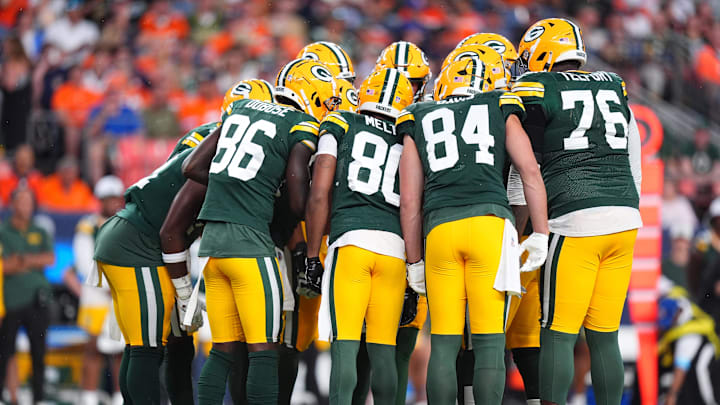 Aug 18, 2024; Denver, Colorado, USA; Members of the Green Bay Packers huddle in the first quarter against the Denver Broncos  at Empower Field at Mile High. Mandatory Credit: Ron Chenoy-Imagn Images