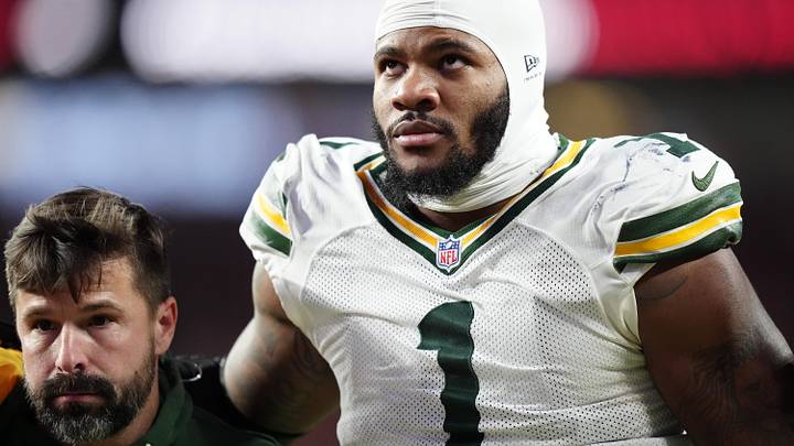 Dec 14, 2025; Denver, Colorado, USA; Green Bay Packers defensive end Micah Parsons (1) walks off the field with help from medical personnel following an injury during the third quarter against the Denver Broncos at Empower Field at Mile High. Mandatory Credit: Ron Chenoy-Imagn Images