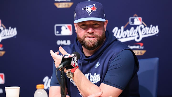 Oct 28, 2025; Los Angeles, California, USA; Toronto Blue Jays manager John Schneider (14) speaks at the postgame press conference after the game against the Los Angeles Dodgers during game four of the 2025 MLB World Series at Dodger Stadium. Mandatory Credit: Kiyoshi Mio-Imagn Images