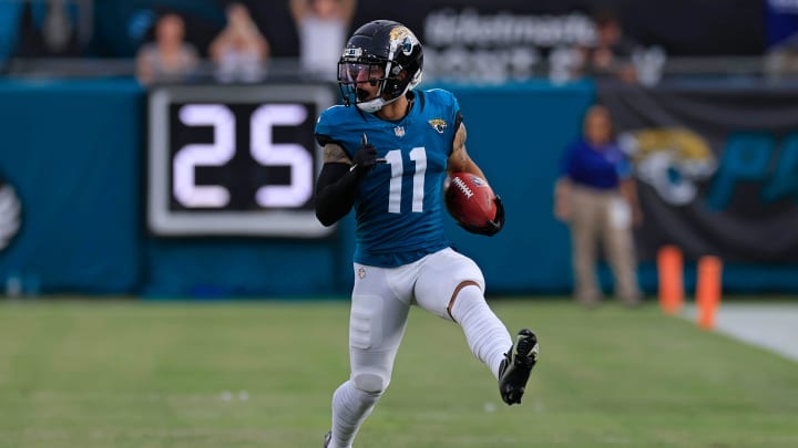 Jacksonville Jaguars wide receiver Parker Washington (11) starts to high step as he rushes for yards during the first quarter of a preseason NFL football game Saturday, Aug. 10, 2024 at EverBank Stadium in Jacksonville, Fla. [Corey Perrine/Florida Times-Union]