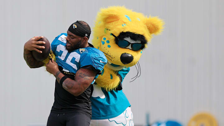 Jacksonville Jaguars mascot Jaxson de Ville plays with running back Jalen Jackson (36) during a combined NFL football training camp session between the Tampa Bay Buccaneers and Jacksonville Jaguars Wednesday, Aug. 14, 2024 at EverBank Stadium’s Miller Electric Center in Jacksonville, Fla. 