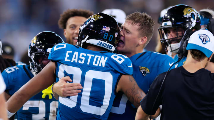 Jacksonville Jaguars quarterback Mac Jones (10) yells into the ear of wide receiver Brevin Easton (80) after Easton scored a touchdown during the fourth quarter of a preseason NFL football game Saturday, Aug. 17, 2024 at EverBank Stadium in Jacksonville, Fla. The Jacksonville Jaguars defeated the Tampa Bay Buccaneers 20-7. 