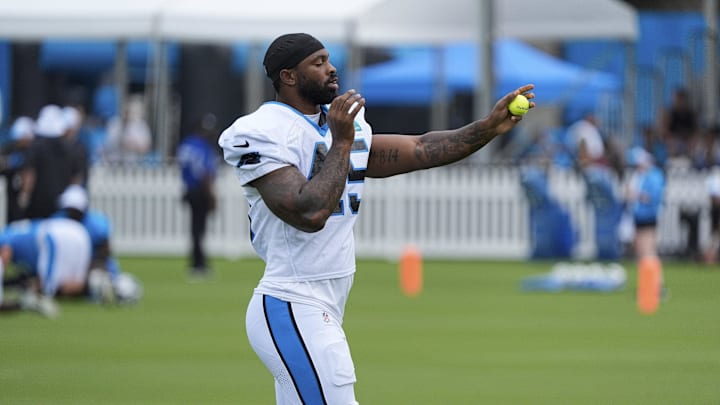 Jul 30, 2024; Charlotte, NC, USA; Carolina Panthers linebacker K'Lavon Chaisson (45) works with a tennis ball at Carolina Panthers Practice Fields. Mandatory Credit: Jim Dedmon-Imagn Images