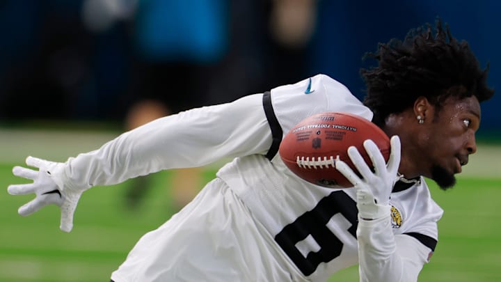 Jacksonville Jaguars safety Darnell Savage (6) falls to the turf after hauling in a reception during the second day of a mandatory minicamp Tuesday, June 11, 2024, at EverBank Stadium's Miller Electric Center in Jacksonville, Fla.