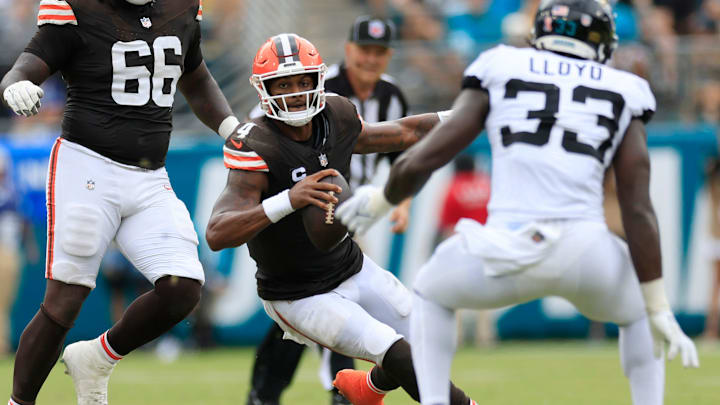 Cleveland Browns quarterback Deshaun Watson (4) rushes for yards against Jacksonville Jaguars linebacker Devin Lloyd (33) during the second quarter of an NFL football matchup Sunday, Sept. 15, 2024 at EverBank Stadium in Jacksonville, Fla. The Browns defeated the Jaguars 18-13. [