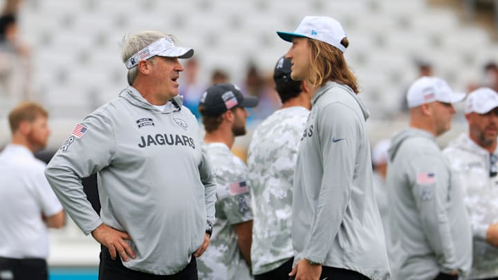 Jacksonville head coach Doug Pederson talks to quarterback Trevor Lawrence (16) before an NFL football matchup Sunday, Nov. 10, 2024 at Everbank Stadium in Jacksonville, Fla.