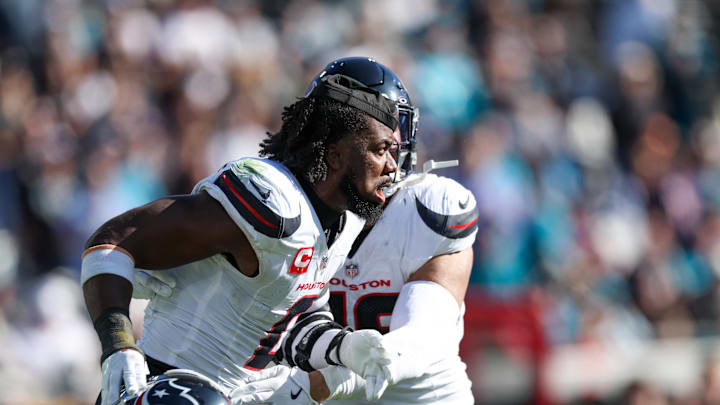 Dec 1, 2024; Jacksonville, Florida, USA;Houston Texans linebacker Azeez Al-Shaair (0) is held back by Houston Texans linebacker Henry To'oTo'o (39) after being ejected against the Jacksonville Jaguars in the second quarter  at EverBank Stadium. Mandatory Credit: Nathan Ray Seebeck-Imagn Images