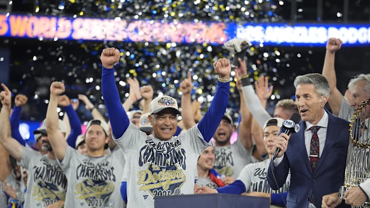 Oct 31, 2025; Toronto, Ontario, CAN; Los Angeles Dodgers manager Dave Roberts (30) celebrates on the podium during the post game celebration after defeating the Toronto Blue Jays in the 2025 MLB World Series at Rogers Centre. Mandatory Credit: John E. Sokolowski-Imagn Images