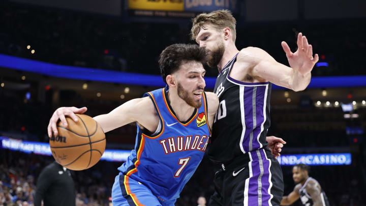 Apr 9, 2024; Oklahoma City, Oklahoma, USA; Oklahoma City Thunder forward Chet Holmgren (7) drives against Sacramento Kings forward Domantas Sabonis (10) during the second half at Paycom Center. Mandatory Credit: Alonzo Adams-USA TODAY Sports