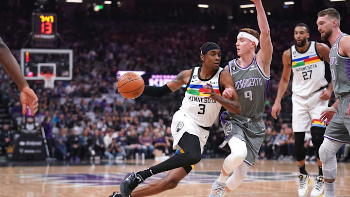 Mar 27, 2023; Sacramento, California, USA; Minnesota Timberwolves forward Jaden McDaniels (3) drives past Sacramento Kings guard Kevin Huerter (9) in the first quarter at the Golden 1 Center. Mandatory Credit: Cary Edmondson-Imagn Images