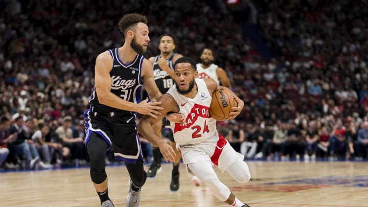 Oct 8, 2023; Vancouver, British Columbia, CAN; Toronto Raptors guard Markquis Nowell (24) drives against Sacramento Kings guard Jordan Ford (31) in the second half at Rogers Arena. Raptors won 112-99. Mandatory Credit: Bob Frid-USA TODAY Sports