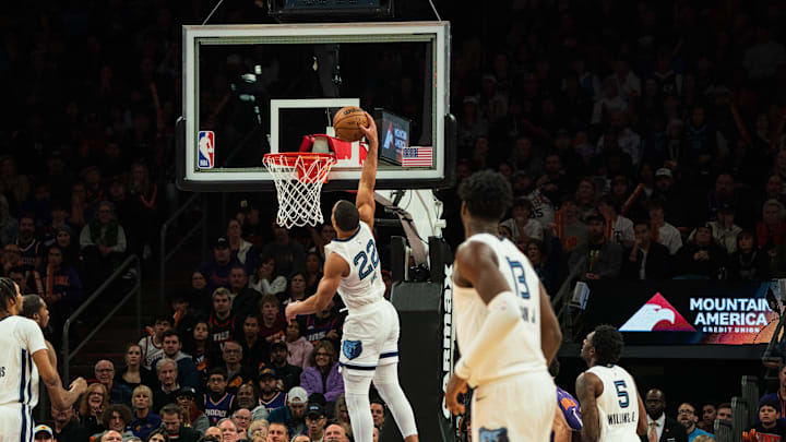 Memphis Grizzlies guard Desmond Bane (22) dunks against the Phoenix Suns during the fourth period at Footprint Center. 
