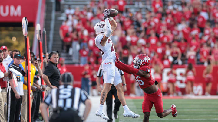 Sep 16, 2023; Piscataway, New Jersey, USA; Virginia Tech Hokies wide receiver Ayden Greene (26) is pushed out of bounds by Rutgers Scarlet Knights defensive back Max Melton (16) during the second half at SHI Stadium. Mandatory Credit: Vincent Carchietta-USA TODAY Sports