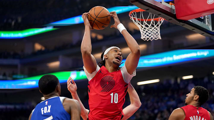 Apr 14, 2024; Sacramento, California, USA; Portland Trail Blazers center Moses Brown (10) holds onto a rebound against the Sacramento Kings in the first quarter at the Golden 1 Center. Mandatory Credit: Cary Edmondson-Imagn Images