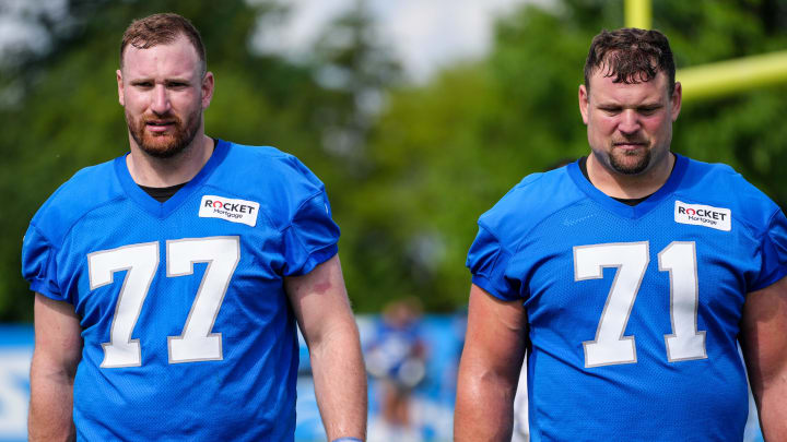 Frank Ragnow and Kevin Zeitler walk off the field together during day two of the Detroit Lions training camp at the Detroit Lions Headquarters in Dearborn, Mich. on Thursday, July 25, 2024.