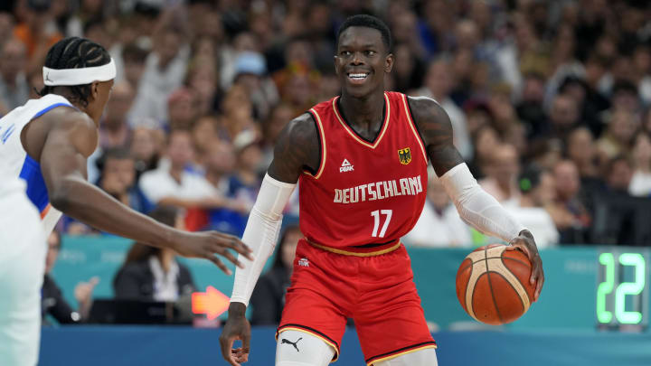 Aug 2, 2024; Villeneuve-d'Ascq, France; Germany point guard Dennis Schroder (17) controls the ball against France point guard Frank Ntilikina (1) in the first half in a men’s group B basketball game during the Paris 2024 Olympic Summer Games at Stade Pierre-Mauroy. Mandatory Credit: John David Mercer-USA TODAY Sports