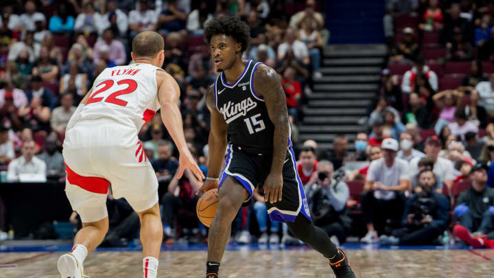 Oct 8, 2023; Vancouver, British Columbia, CAN; Toronto Raptors guard Malachi Flynn (22) guards Sacramento Kings guard Davion Mitchell (15) as he dribbles the ball in the first half at Rogers Arena. Mandatory Credit: Bob Frid-USA TODAY Sports