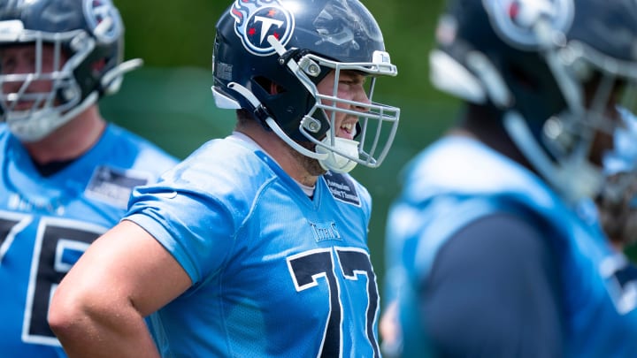 Offensive lineman Peter Skoronski (77) runs through drills during Tennessee Titans practice at Ascension Saint Thomas Sports Park in Nashville, Tenn., Wednesday, May 29, 2024.