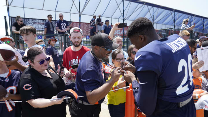 Wide receiver John Jackson signs autographs at Halas Hall. The Bears returned Tuesday to training camp for the final week the general public is allowed at practice.