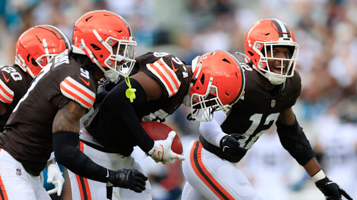 Cleveland Browns defensive end Ogbo Okoronkwo (54), center, carries what he thought would be a turnover with teammates running back Pierre Strong Jr. (20), safety Grant Delpit (9) and safety Rodney McLeod Jr. (12) celebrating along during the second quarter of an NFL football matchup Sunday, Sept. 15, 2024 at EverBank Stadium in Jacksonville, Fla. The Browns defeated the Jaguars 18-13. [Corey Perrine/Florida Times-Union]