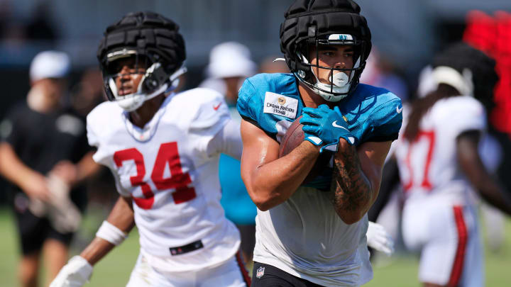 Jacksonville Jaguars tight end Brenton Strange (85) finishes his run against Tampa Bay Buccaneers cornerback Bryce Hall (34) during a combined NFL football training camp session between the Tampa Bay Buccaneers and Jacksonville Jaguars Wednesday, Aug. 14, 2024 at EverBank Stadium’s Miller Electric Center in Jacksonville, Fla. [Corey Perrine/Florida Times-Union]