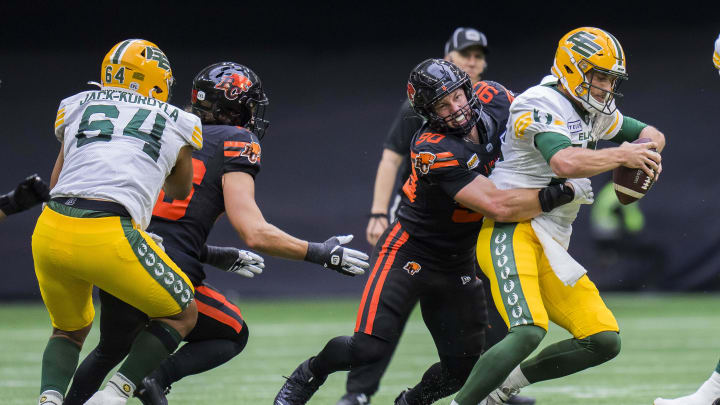 Jun 17, 2023; Vancouver, British Columbia, CAN; BC Lions defensive lineman Mathieu Betts (90) sacks Edmonton Elks quarterback Taylor Cornelius (15) in the second half at BC Place. BC won 22-0. Mandatory Credit: Bob Frid-USA TODAY Sports