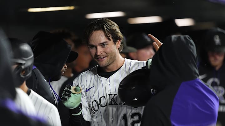 Sep 16, 2025; Denver, Colorado, USA; Colorado Rockies third baseman Kyle Karros (12) celebrates scoring a run in the eighth inning against the Miami Marlins at Coors Field. Sep 16, 2025; Denver, Colorado, USA; Colorado Rockies third baseman Kyle Karros (12) celebrates scoring a run in the eighth inning against the Miami Marlins at Coors Field.