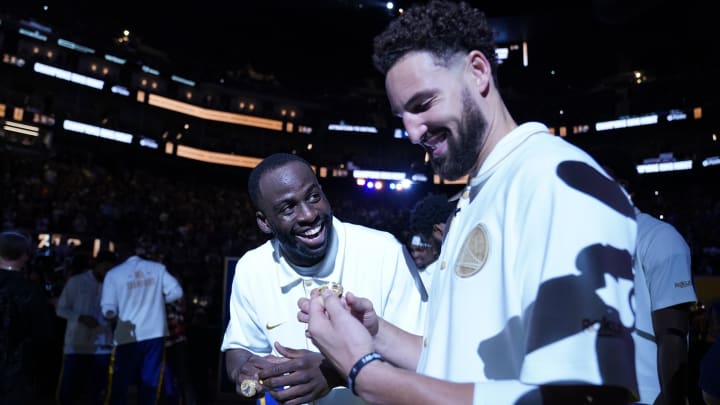 October 18, 2022; San Francisco, California, USA; Golden State Warriors forward Draymond Green (23) and guard Klay Thompson (11) receive their championship ring before the game against the Los Angeles Lakers at Chase Center. Mandatory Credit: Kyle Terada-USA TODAY Sports