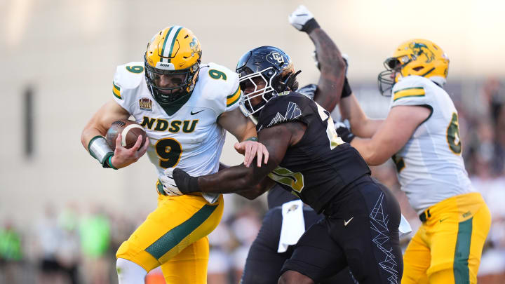 Colorado Buffaloes linebacker LaVonta Bentley tackles North Dakota State Bison quarterback Cole Payton 