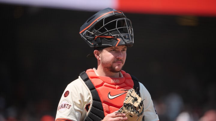 Jul 28, 2024; San Francisco, California, USA; San Francisco Giants catcher Patrick Bailey (14) stands on the field with his catchers mask raised against the Colorado Rockies during the fifth inning at Oracle Park.