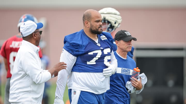 Jul 24, 2024; East Rutherford, NJ, USA; New York Giants guard Jermaine Eluemunor (72) walks off the field after an injury during training camp at Quest Diagnostics Training Facility.  