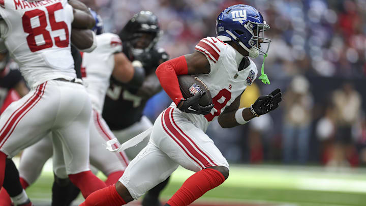 Aug 17, 2024; Houston, Texas, USA; New York Giants wide receiver Malik Nabers (9) runs with the ball during the game against the Houston Texans at NRG Stadium.  