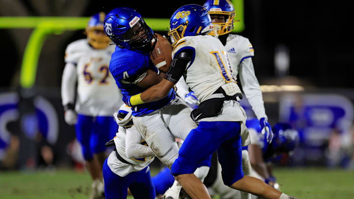 Trinity Christian's Darnell Rogers (4) is tackled by Orlando Christian Prep's Ezekiel \"Zeke\" Gunn (11) during the second quarter of an FHSAA Region 1-1M high school football playoff matchup in 2023. Gunn will be a senior this fall at OCP. Trinity Christian's Darnell Rogers (4) is tackled by Orlando Christian Prep's Ezekiel \"Zeke\" Gunn (11) during the second quarter of an FHSAA Region 1-1M high school football playoff matchup in 2023. Gunn will be a senior this fall at OCP.