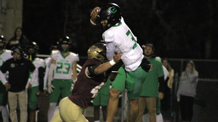 St. Augustine linebacker Mason Beane (42) rushes Choctawhatchee quarterback Tamen Zabetkis (3) during an FHSAA Region 1-4A high school football final on November 29, 2024. [Clayton Freeman/Florida Times-Union]