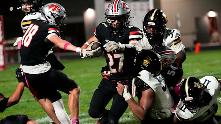 City High’s Dominic Roe (27) carries the ball during a high school football game against Southeast Polk Oct. 3, 2025 at Iowa City High in Iowa City, Iowa.
