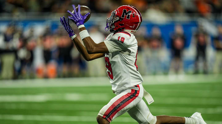 Orchard Lake St. Mary’s WR Angelo Chapman catches a 33-yard pass for a touchdown against Byron Center during the second half of the Michigan High School Athletic Association division two football finals at Ford Field in Detroit on Friday, Nov. 29, 2024.