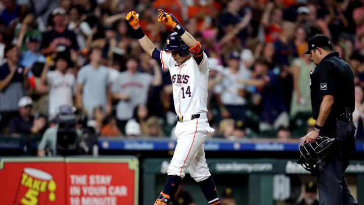 Jul 31, 2024; Houston, Texas, USA; Houston Astros pinch hitter Mauricio Dubón (14) reacts after hitting a two-run home run against the Pittsburgh Pirates during the sixth inning at Minute Maid Park.