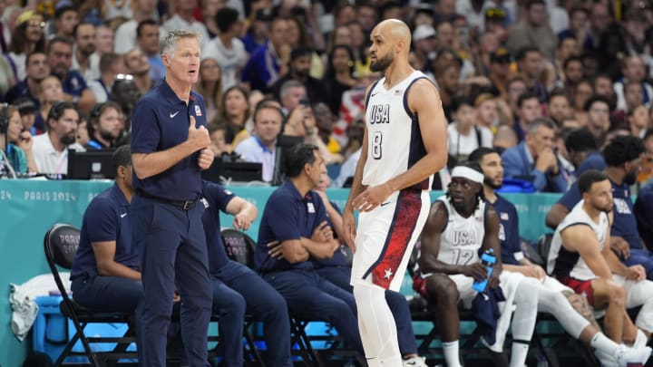 Jul 31, 2024; Villeneuve-d'Ascq, France; United States head coach Steve Kerr talks to United States guard Derrick White (8) in the first quarter against South Sudan during the Paris 2024 Olympic Summer Games at Stade Pierre-Mauroy. Mandatory Credit: John David Mercer-USA TODAY Sports