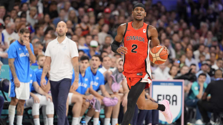 Jul 27, 2024; Villeneuve-d'Ascq, France; Canada guard Shai Gilgeous-Alexander (2) controls the ball against Greece in the first quarter during the Paris 2024 Olympic Summer Games at Stade Pierre-Mauroy. Mandatory Credit: John David Mercer-USA TODAY Sports