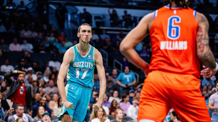 Apr 7, 2024; Charlotte, North Carolina, USA; Charlotte Hornets forward Aleksej Pokusevski (17) celebrates after scoring against the Oklahoma City Thunder during the third quarter at Spectrum Center. Mandatory Credit: Scott Kinser-USA TODAY Sports