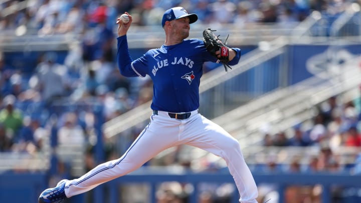 Feb 28, 2024; Dunedin, Florida, USA;  Toronto Blue Jays relief pitcher Trevor Richards (33) throws a pitch against the Tampa Bay Rays in the fifth inning at TD Ballpark. Mandatory Credit: Nathan Ray Seebeck-USA TODAY Sports