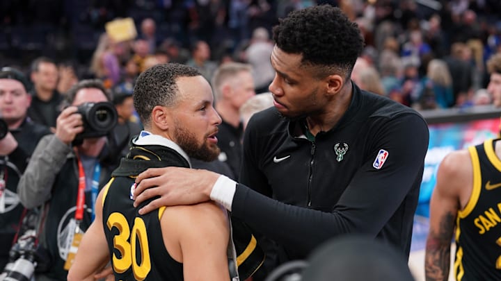 Milwaukee Bucks forward Giannis Antetokounmpo (34) and Golden State Warriors guard Stephen Curry (30).