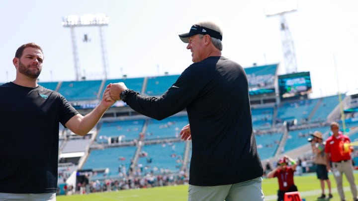 Jacksonville Jaguars head coach Doug Pederson, right, fist bumps offensive coordinator Press Taylor before an NFL football matchup Sunday, Sept. 24, 2023 at EverBank Stadium in Jacksonville, Fla. [Corey Perrine/Florida Times-Union]