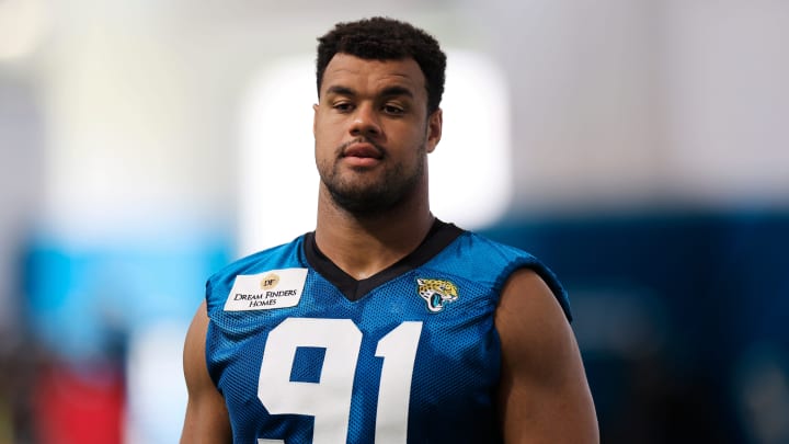 Jacksonville Jaguars defensive lineman Arik Armstead (91) walks to be interviewed after a combined NFL football training camp session between the Tampa Bay Buccaneers and Jacksonville Jaguars Wednesday, Aug. 14, 2024 at EverBank Stadium’s Miller Electric Center in Jacksonville, Fla. [Corey Perrine/Florida Times-Union]