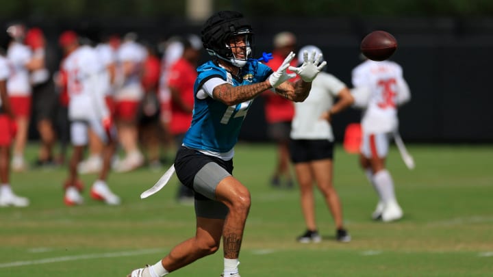 Jacksonville Jaguars wide receiver Elijah Cooks (14) catches a pass during a combined NFL football training camp session between the Tampa Bay Buccaneers and Jacksonville Jaguars Thursday, Aug. 15, 2024 at EverBank Stadium’s Miller Electric Center in Jacksonville, Fla. [Corey Perrine/Florida Times-Union]