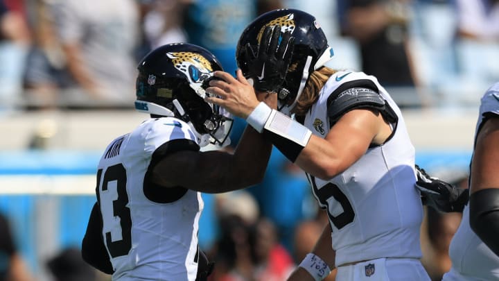 Jacksonville Jaguars wide receiver Christian Kirk (13) is congratulated by quarterback Trevor Lawrence (16) for his touchdown score during the fourth quarter of an NFL football matchup Sunday, Sept. 24, 2023 at EverBank Stadium in Jacksonville, Fla. The Houston Texans defeated the Jacksonville Jaguars 37-17. [Corey Perrine/Florida Times-Union]