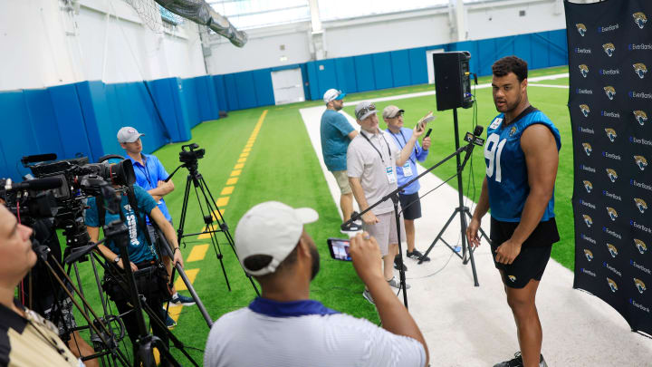 Jacksonville Jaguars defensive lineman Arik Armstead (91) is interviewed after a combined NFL football training camp session between the Tampa Bay Buccaneers and Jacksonville Jaguars Wednesday, Aug. 14, 2024 at EverBank Stadium’s Miller Electric Center in Jacksonville, Fla. [Corey Perrine/Florida Times-Union]