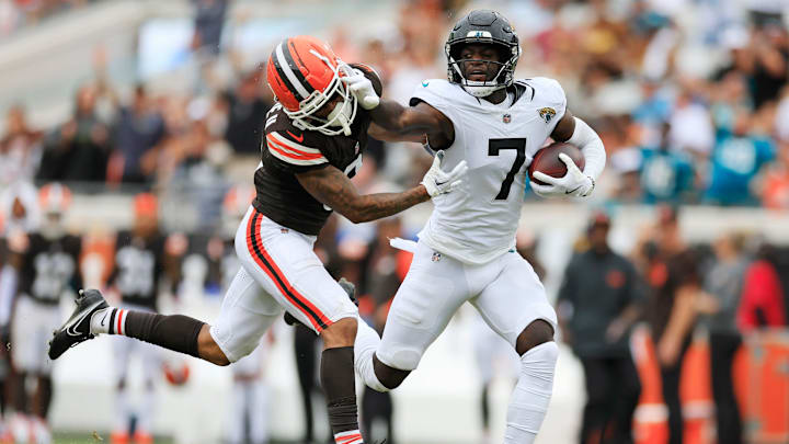 Jacksonville Jaguars wide receiver Brian Thomas Jr. (7) stiff arms Cleveland Browns cornerback Greg Newsome II (0) during the third quarter of an NFL football matchup Sunday, Sept. 15, 2024 at EverBank Stadium in Jacksonville, Fla. The Browns defeated the Jaguars 18-13. [Corey Perrine/Florida Times-Union]